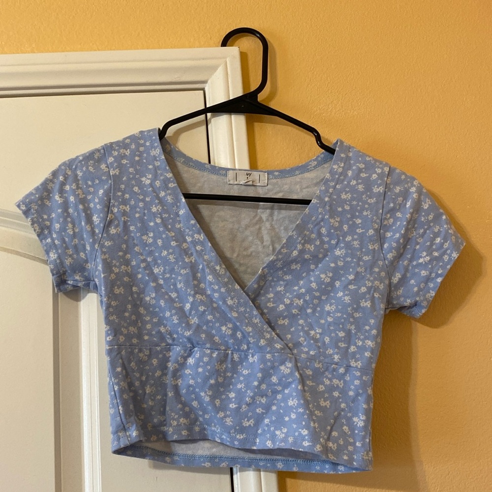 Blue top with white flowers! Size small and worn only a few times